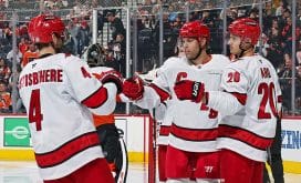 PHILADELPHIA, PENNSYLVANIA - MARCH 15: Taylor Hall #71 of the Carolina Hurricanes celebrates his second period power-play goal against the Philadelphia Flyers with Shayne Gostisbehere #4 and Sebastian Aho #20 at the Wells Fargo Center on March 15, 2025 in Philadelphia, Pennsylvania.