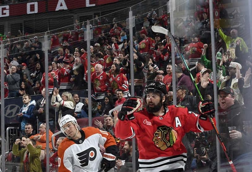 CHICAGO, ILLINOIS - MARCH 23: Patrick Maroon #77 of the Chicago Blackhawks reacts after scoring against the Philadelphia Flyers in the first period at the United Center on March 23, 2025 in Chicago, Illinois.
