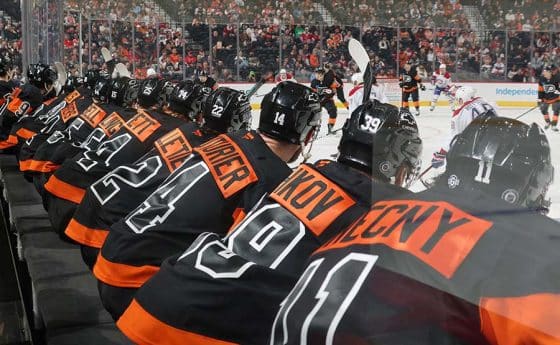 PHILADELPHIA, PENNSYLVANIA - MARCH 27: Members of the Philadelphia Flyers watch the play on the ice during the first period against the Montreal Canadiens at the Wells Fargo Center on March 27, 2025 in Philadelphia, Pennsylvania.