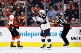 PHILADELPHIA, PENNSYLVANIA - APRIL 15: Kent Johnson #91 of the Columbus Blue Jackets celebrates his power play goal as Tyson Foerster #71 of the Philadelphia Flyers reacts during the second period at the Wells Fargo Center on April 15, 2025 in Philadelphia, Pennsylvania.