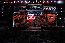 LOS ANGELES, CALIFORNIA - JUNE 27: Porter Martone poses with NHL commissioner Gary Bettman after being drafted by the Philadelphia Flyers with the number six overall pick during the first round of the 2025 Upper Deck NHL Draft at the Peacock Theater on June 27, 2025 in Los Angeles, California.