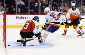 PHILADELPHIA, PENNSYLVANIA - OCTOBER 02: Emil Heineman #51 of the New York Islanders scores a goal past Samuel Ersson #33 of the Philadelphia Flyers during the third-period of a preseason game at Xfinity Mobile Arena on October 02, 2025 in Philadelphia, Pennsylvania.