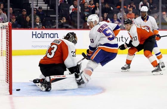 PHILADELPHIA, PENNSYLVANIA - OCTOBER 02: Emil Heineman #51 of the New York Islanders scores a goal past Samuel Ersson #33 of the Philadelphia Flyers during the third-period of a preseason game at Xfinity Mobile Arena on October 02, 2025 in Philadelphia, Pennsylvania.