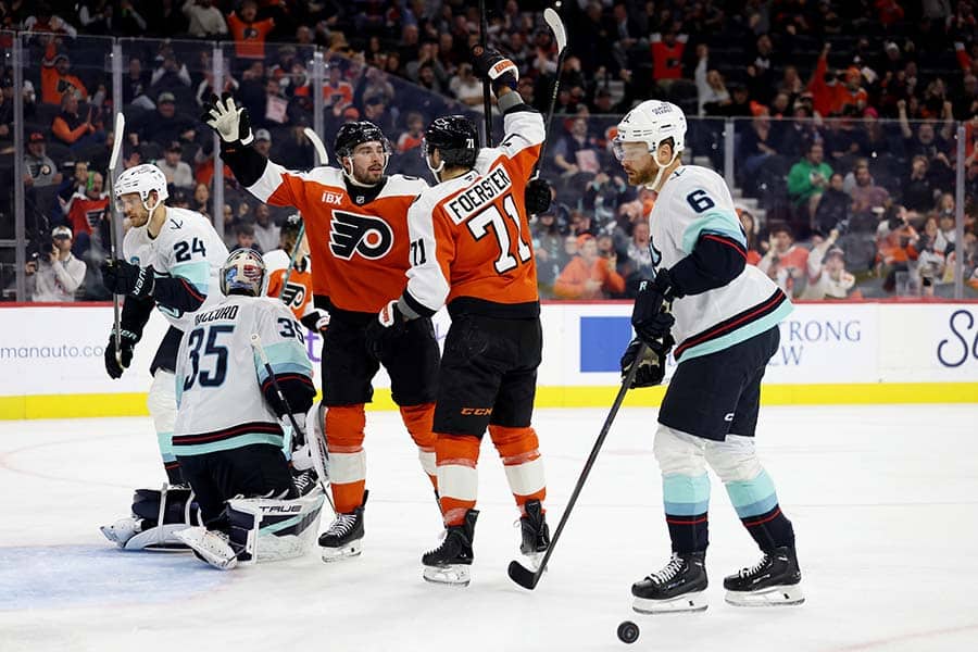 PHILADELPHIA, PENNSYLVANIA - OCTOBER 20: Tyson Foerster #71 of the Philadelphia Flyers celebrates his goal with Noah Cates #27 during the second period of a game against the Seattle Kraken at Xfinity Mobile Arena on October 20, 2025 in Philadelphia, Pennsylvania.