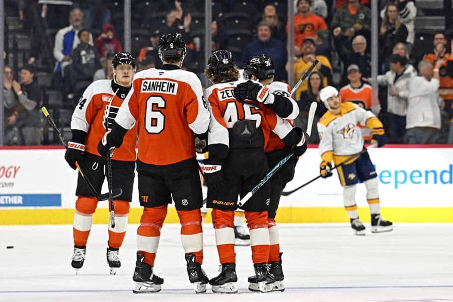 Oct 30, 2025; Philadelphia, Pennsylvania, USA; Philadelphia Flyers center Trevor Zegras (46) celebrates his goal with teammates against the Nashville Predators during the second period at Xfinity Mobile Arena.