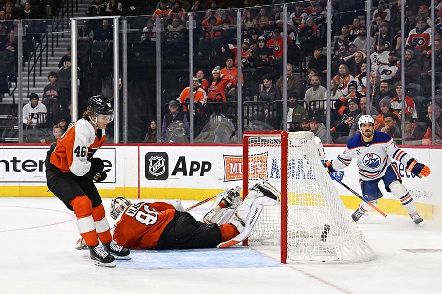 Nov 12, 2025; Philadelphia, Pennsylvania, USA; Edmonton Oilers center Jack Roslovic (28) celebrates his game winning goal in overtime past Philadelphia Flyers goaltender Dan Vladar (80) at Xfinity Mobile Arena.