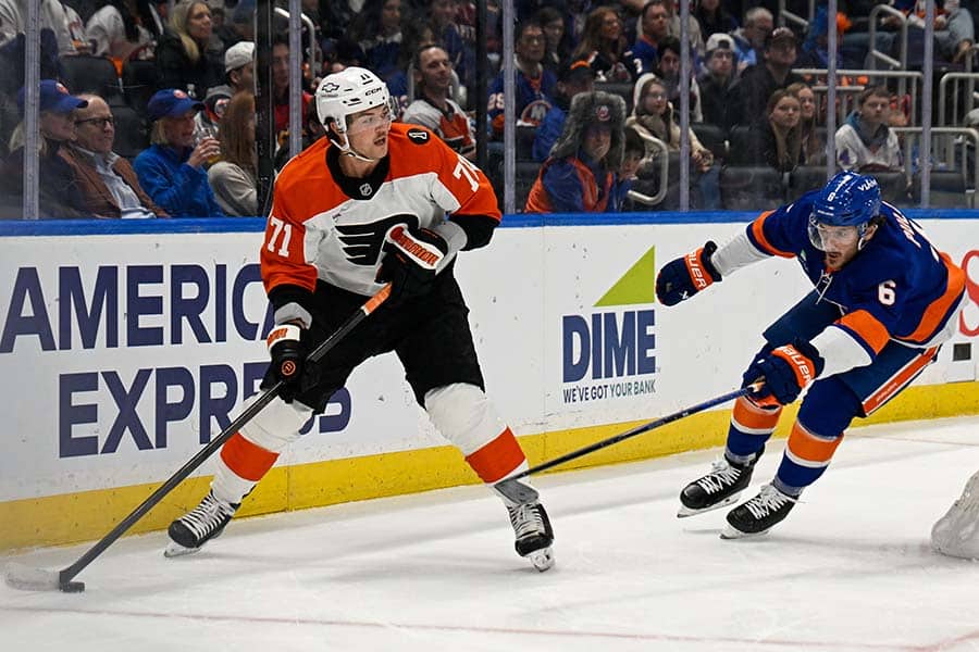 Nov 28, 2025; Elmont, New York, USA; Philadelphia Flyers right wing Tyson Foerster (71) looks to make a pass defended by New York Islanders defenseman Ryan Pulock (6) during the first period at UBS Arena.