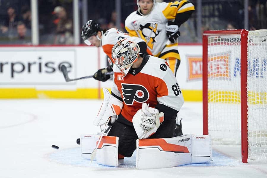 Dec 1, 2025; Philadelphia, Pennsylvania, USA; Philadelphia Flyers goalie Dan Vladar (80) makes a save against the Pittsburgh Penguins in the second period at Xfinity Mobile Arena.
