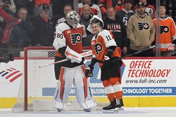Dec 9, 2025; Philadelphia, Pennsylvania, USA; Philadelphia Flyers goaltender Dan Vladar (80) and right wing Travis Konecny (11) celebrate win against the San Jose Sharks at Xfinity Mobile Arena.