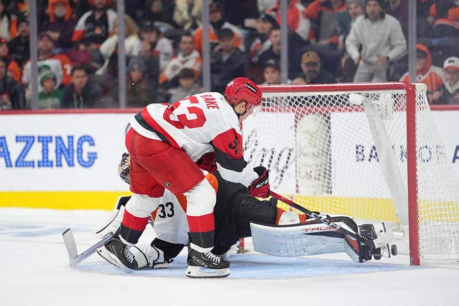 Dec 13, 2025; Philadelphia, Pennsylvania, USA; Carolina Hurricanes right wing Jackson Blake (53) scores a shootout goal against Philadelphia Flyers goalie Samuel Ersson (33) in overtime at Xfinity Mobile Arena.