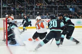 Dec 28, 2025; Seattle, Washington, USA; Seattle Kraken goaltender Philipp Grubauer (31) blocks a goal shot by Philadelphia Flyers center Sean Couturier (14) during the third period at Climate Pledge Arena.