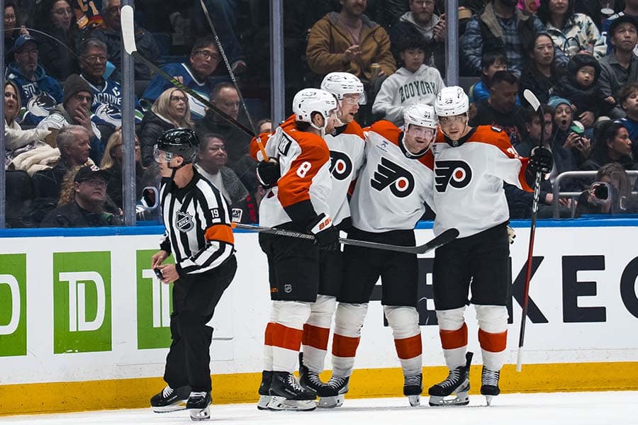 Dec 30, 2025; Vancouver, British Columbia, CAN; Philadelphia Flyers defenseman Cam York (8), forward Garnet Hathaway (19), forward Carl Grundstrom (91) and forward Nikita Grebenkin (29) celebrate Grundstrom’s goal against the Vancouver Canucks in the second period at Rogers Arena.