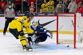 ST PAUL, MINNESOTA - JANUARY 4: Jack Berglund #26 of Sweden scores a goal on Petteri Rimpinen #30 of Finland in shootout of a semifinal game during the IIHF World Junior Hockey Championship at Grand Casino Arena on January 04, 2026 in St Paul, Minnesota.