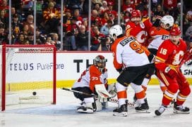 Dec 31, 2025; Calgary, Alberta, CAN; Calgary Flames left wing Jonathan Huberdeau (not pictured) scores a goal against Philadelphia Flyers goaltender Samuel Ersson (33) during the second period at Scotiabank Saddledome.