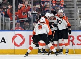 Jan 3, 2026; Edmonton, Alberta, CAN; Philadelphia Flyers defenseman Jamie Drysdale (9) with Flyers center Denver Barkey (52) and Flyers center Sean Couturier (14) celebrates Barkey’s goal against the Edmonton Oilers during the first period at Rogers Place.