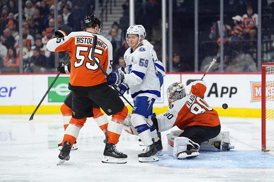 Jan 12, 2026; Philadelphia, Pennsylvania, USA; Tampa Bay Lightning center Jake Guentzel (59) deflects a shot for a goal against Philadelphia Flyers defenseman Rasmus Ristolainen (55) in the second period at Xfinity Mobile Arena.