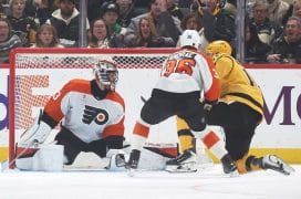 Jan 15, 2026; Pittsburgh, Pennsylvania, USA; Pittsburgh Penguins right wing Justin Brazeau (right) scores a power play goal against Philadelphia Flyers goaltender Samuel Ersson (33) during the first period at PPG Paints Arena.